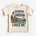 Someone in Oregon Loves Me design on a natural beige short sleeve T-shirt