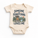 Someone in Pennsylvania Loves Me design on a natural beige baby bodysuit