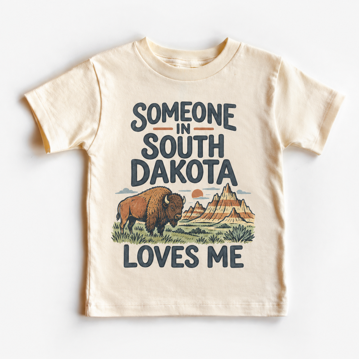 Someone in South Dakota Loves Me design on a natural beige short sleeve T-shirt