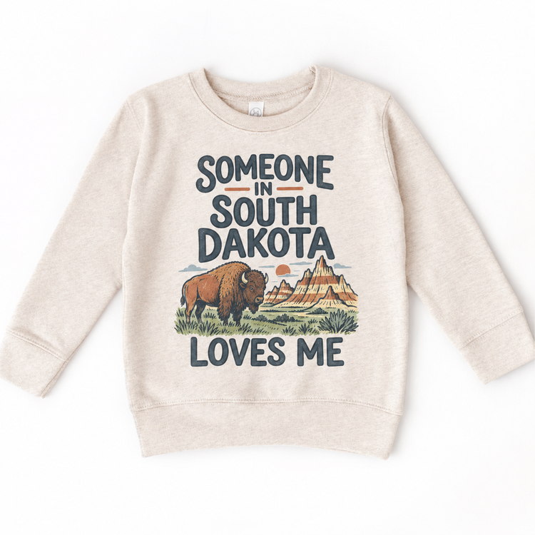 Someone in South Dakota Loves Me design on a natural beige sweatshirt