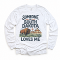 Someone in South Dakota Loves Me design on a white long sleeve T-shirt