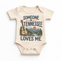 Someone in Tennessee Loves Me design on a natural beige baby bodysuit