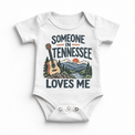 Someone in Tennessee Loves Me design on a white baby bodysuit