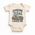 Someone in Texas Loves Me design on a natural beige baby bodysuit
