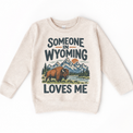 Someone in Wyoming Loves Me design on a natural beige sweatshirt
