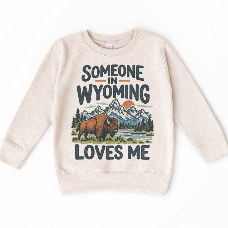 Someone in Wyoming Loves Me design on a natural beige sweatshirt