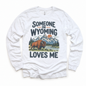 Someone in Wyoming Loves Me design on a white long sleeve T-shirt