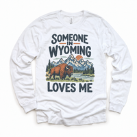 Someone in Wyoming Loves Me design on a white long sleeve T-shirt