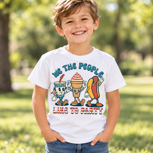 Child wearing a white We The People Like To Party Shirt outdoors